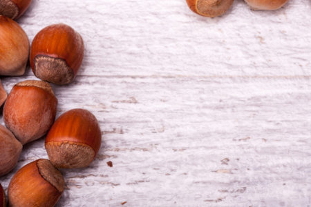 Nuts on wooden background in close up photo