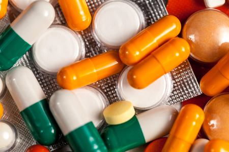 Healthcare medication. Pharmacy drugs and pills on table in close up photoの写真素材