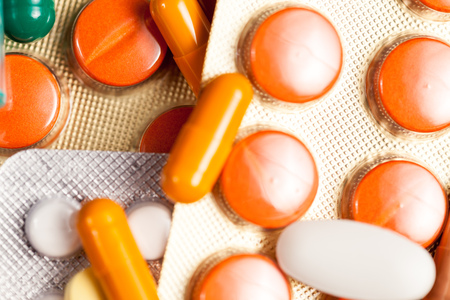 Different type of pills, drugs and painkillers in close up photo. Healthcare and treatmentの写真素材