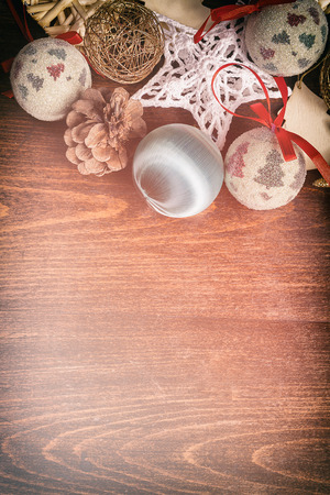 Christmas decorations on wooden background. Vintage toning. Winter decorations tableの写真素材