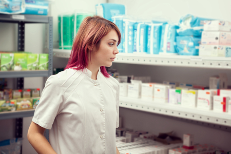 Doctor in the warehouse looking at products. Healthcare business. Medicine and pharmacyの写真素材