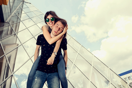 Smiling couple having fun outside on office building background. Spending quality time together.Happy  Relationshipの写真素材