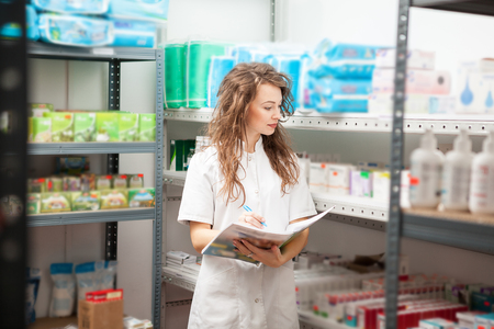Pharmacist in the storage facility making an inspection. Healthcare businessの写真素材