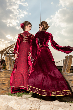 Gorgeous two ladies in vintage clothes on a boat. Luxury and glamourの写真素材
