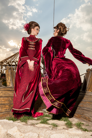 Gorgeous two ladies in vintage clothes on a boat. Luxury and glamourの写真素材
