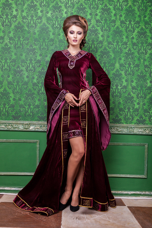 Elegant woman dressed vintage clothes in retro interior. Rococo period. Luxury and high classの写真素材