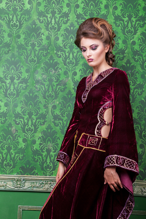 Vogue woman dressed in vintage clothes in retro interior. Rococo period. Luxury and high classの写真素材