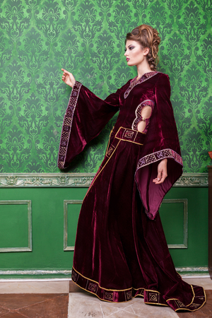 Gorgeous person dressed in vintage clothes in retro interior. Rococo period. Luxury and high classの写真素材