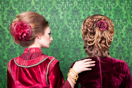 Beautiful hairstyle in vintage style in retro interior. Rococo period. Luxury and high classの写真素材