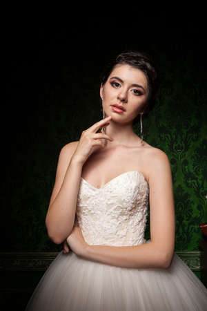 Gorgeous bride in green vintage interior. Happiness and marriageの写真素材
