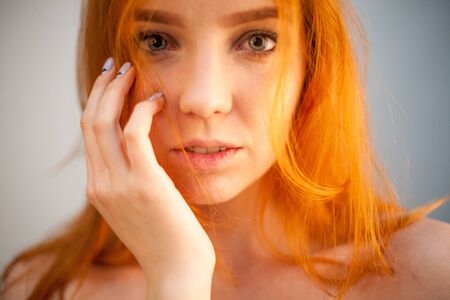 Dreammy gorgeous portrait of redhead woman in soft focus in studio photo. Attractive and beautiful womanの写真素材