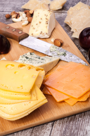 Healthy snaks from different type of cheese, nuts and plums. Healthy food. Snacks and productsの写真素材