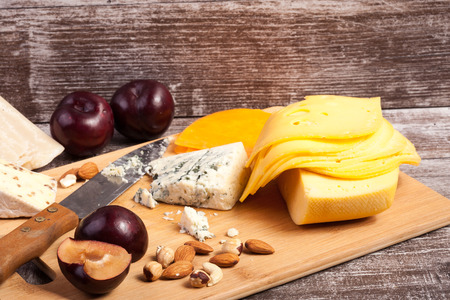 Gourmet cheese apetizer on wooden background. Delicatessen snackの写真素材