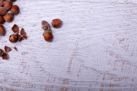 Hazelnuts on wooden background. Over top viewの写真素材