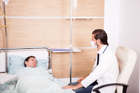 Doctor with patient in recovery room. Modern medicine and healthcareの写真素材