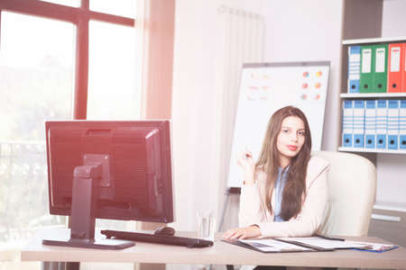 Happy Young professional businesswoman working in the office. Business and marketingの写真素材
