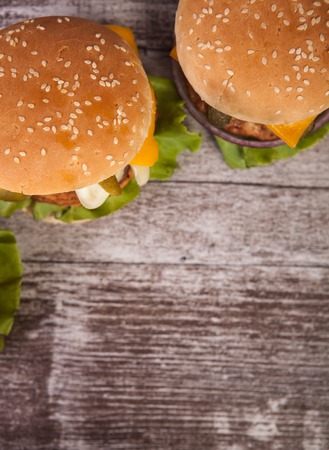 Close up of Delicious tasty burgers on wooden background. Fast and tasty foodの写真素材