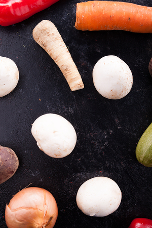Mix of fresh vegetables on a wooden dark tableの写真素材