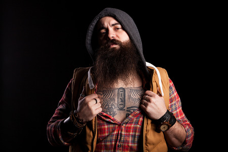 Hipster with a long beard on black backgroundの写真素材