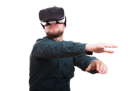 Man wearing a VR headset with his hands in the air isolated over white background