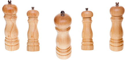Wooden salt shaker and pepper mill isolated on white background. Traditional cuisine cooking accessoryの写真素材