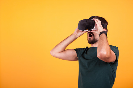 Man wearing VR virtual reality headset is amazed. Modern technologyの写真素材