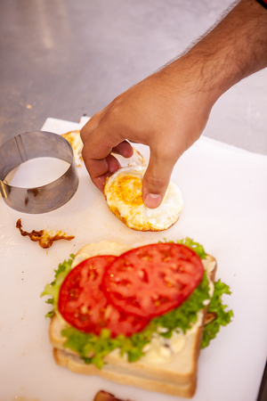Chef making sandwich with fresh ingredient.Delicious nutritionの写真素材