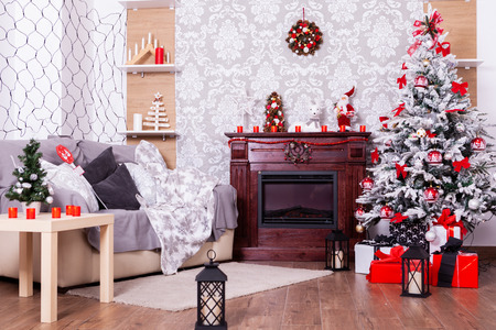 Beautiful Christmas interior with fireplace and fir tree.Happy place .の写真素材