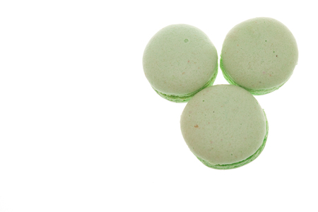 Group of green macaroons isolated on white backgroundの写真素材