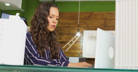 Architect in creative agency working on new project.の写真素材