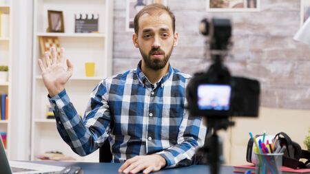 Famous young man recording a vlog for subscribers. Influencer using modern technology for vlogging.