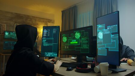Excited hacker girl after gets access granted on cyber attack. Dangerous internet criminals.