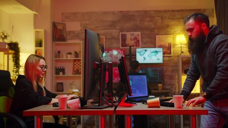 Team of hackers running while the police is coming to catch them.の写真素材