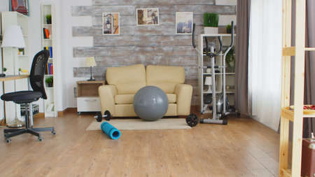 Fitness accessories for home training in room with nobody in it.の写真素材
