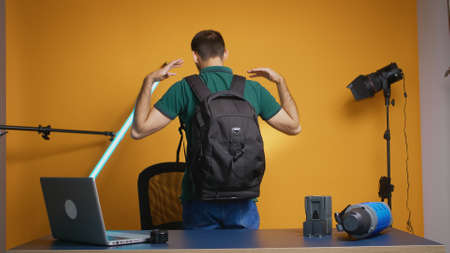 Photographer recording testimonial about dslr backpack for vlog and subscribers.の写真素材