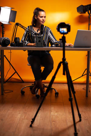 Recording episode about V mount batteries for vlog. Professional videography gear review by content creator new media star influencer on social media.の写真素材