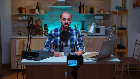 Famous blogger in home studio broadcasting using modern technology. Creative online show On-air...