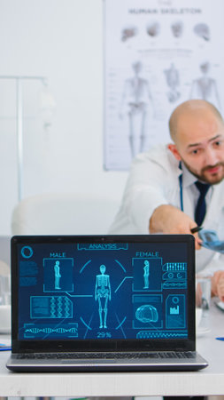 Team of doctors with diverse ages brainstorming sitting on desk in hospital meeting office placing...