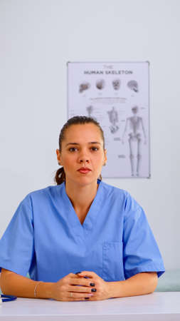 Pov of young doctor on online video call offering medical support to patients. Physician using...