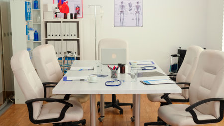 Empty hospital doctor meeting conference room, modern professional office board. Clinic interior with nobody in it, ready for medical conference with profesional doctors.の写真素材