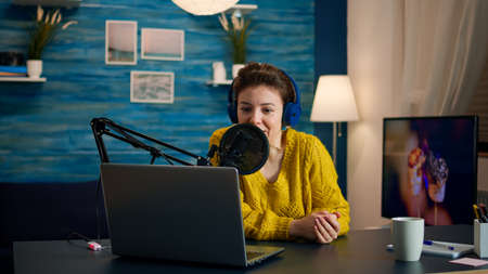 Blogger speaking with followers on live podcast using headphones. Creative online show On-air...