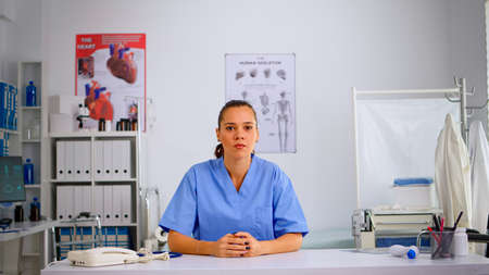 Pov of young doctor on online video call offering medical support to patients. Physician using virtual discussion to consult people, telemedicine and healthcare support, virtual meeting.の写真素材