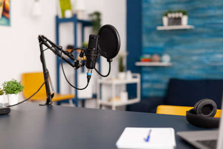 Close up of professional equipment for recording podcast in vlogger home studio. Influencer making social media content with production microphone and digital web internet streaming stationの写真素材