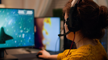 Gamer playing video game on championship discussing with teammates using mic of headset. Pro-gamner...
