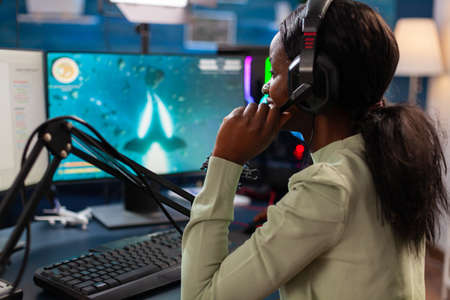 Professional gamer participating in esport tournament talking into microphone. Streaming viral video...