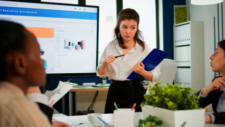 Business partners planning strategy at meeting conference, working with digital interactive...