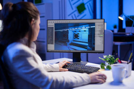 Editor developing new movie project, editing audio film montage sitting in production office late at...