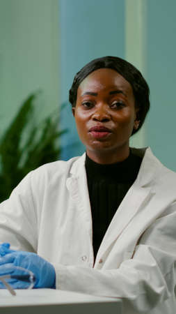 Pov of chemist scientific woman talking about biotechnology healthcare during online videocall...