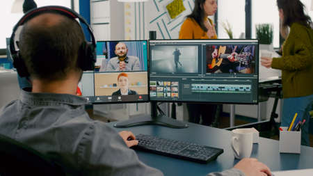 Project manager in web online meeting with team on video call editing client work, getting feedback...