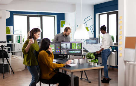 Videographers processing movie montage with post production softwareの写真素材